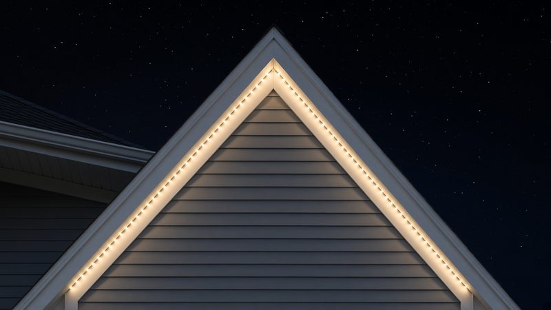 Design rendering of a gable peak at night, with warm white LED points following both roof edges up to the apex
